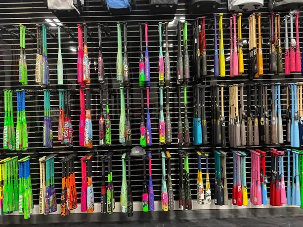 Wall of baseball and softball bats